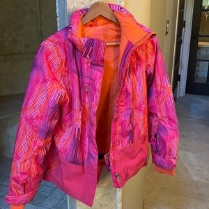 Spyder girls warm snow jacket size 16. Orange inside dark pink patterned outside